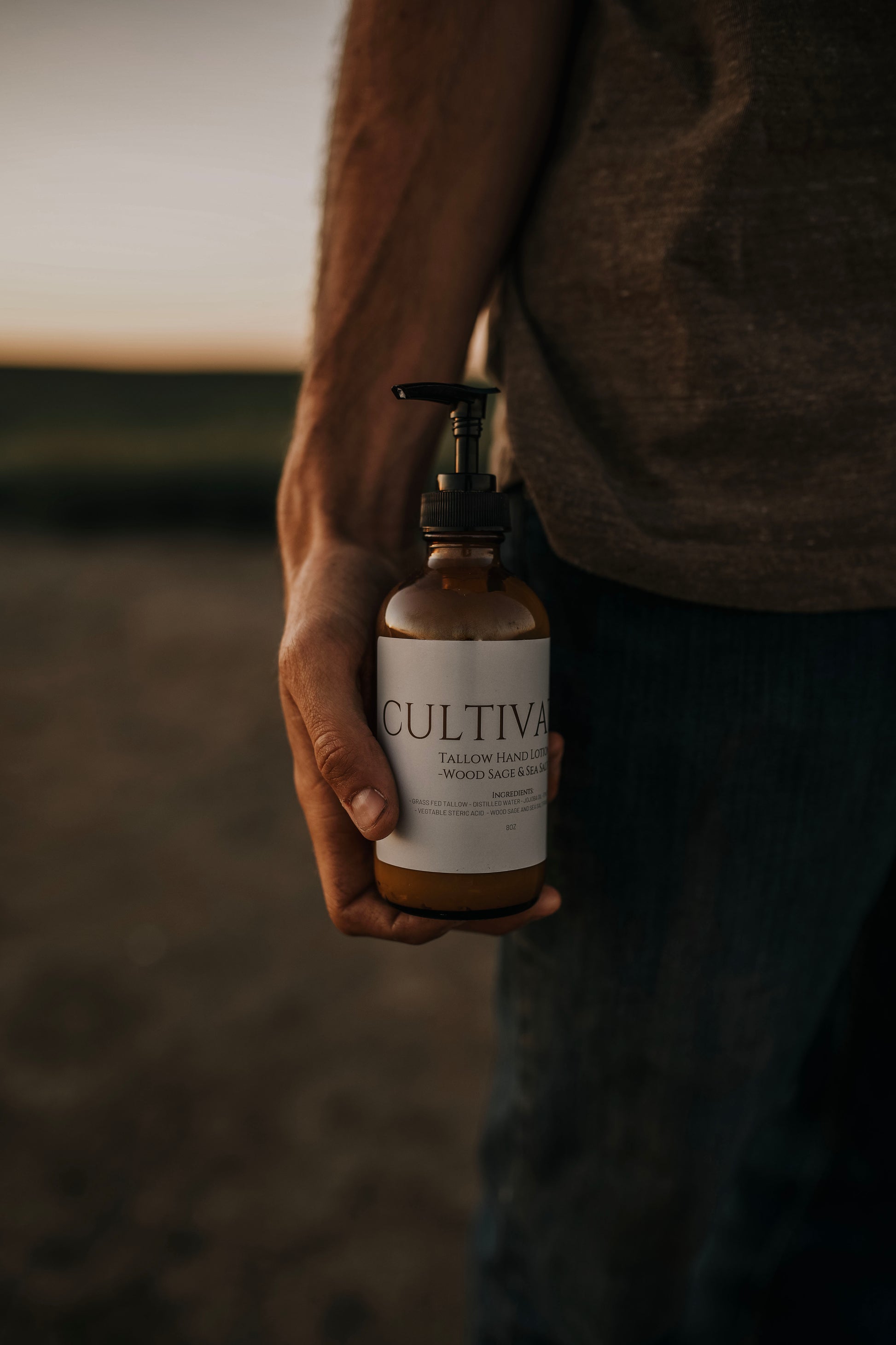 Till & Tallow Cultivated Pump Lotion bottle person holding, handcrafted in Alberta.