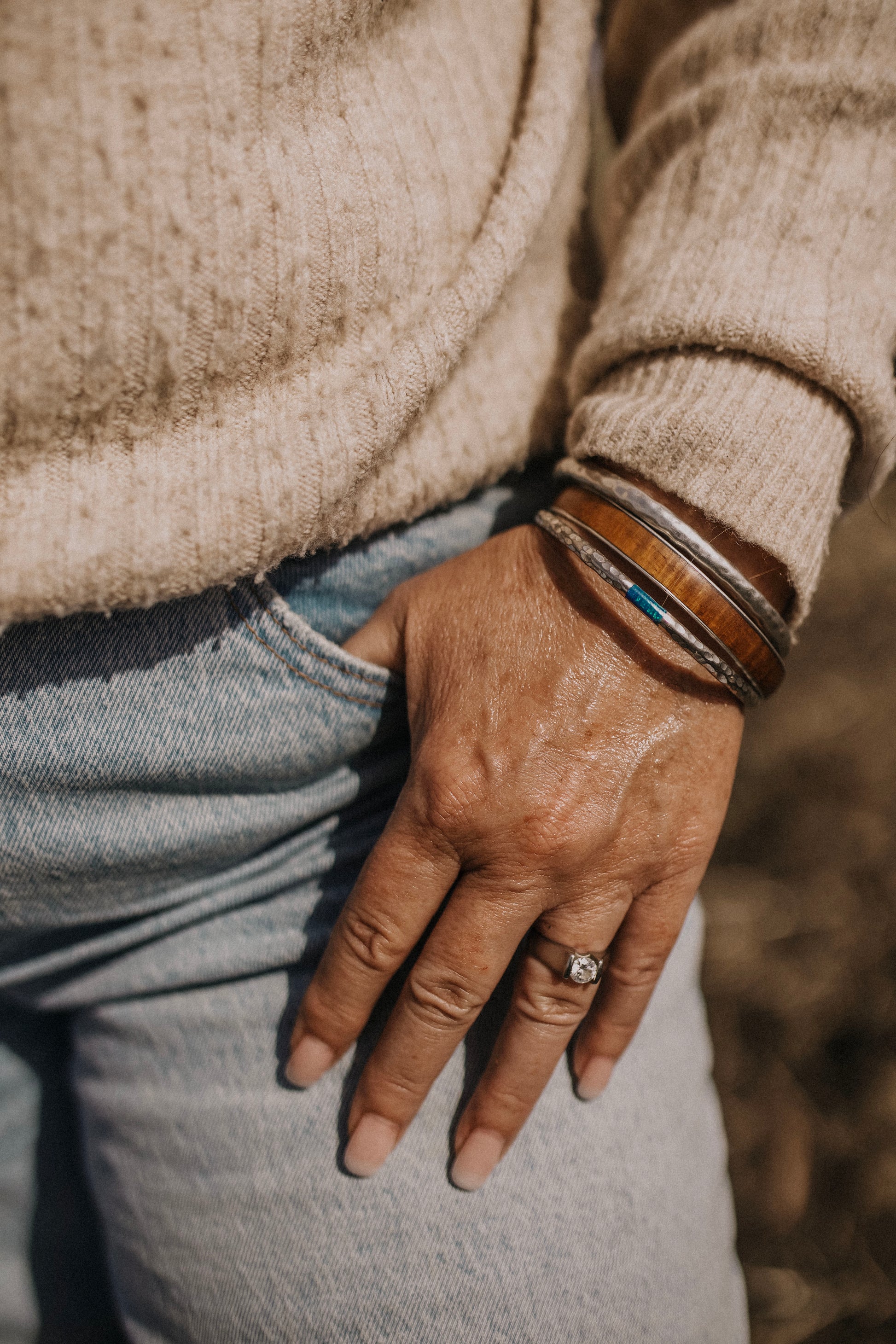 Till & Tallow Golden Hour Body Shimmer on hand showing shimmer glow, handcrafted in Alberta.