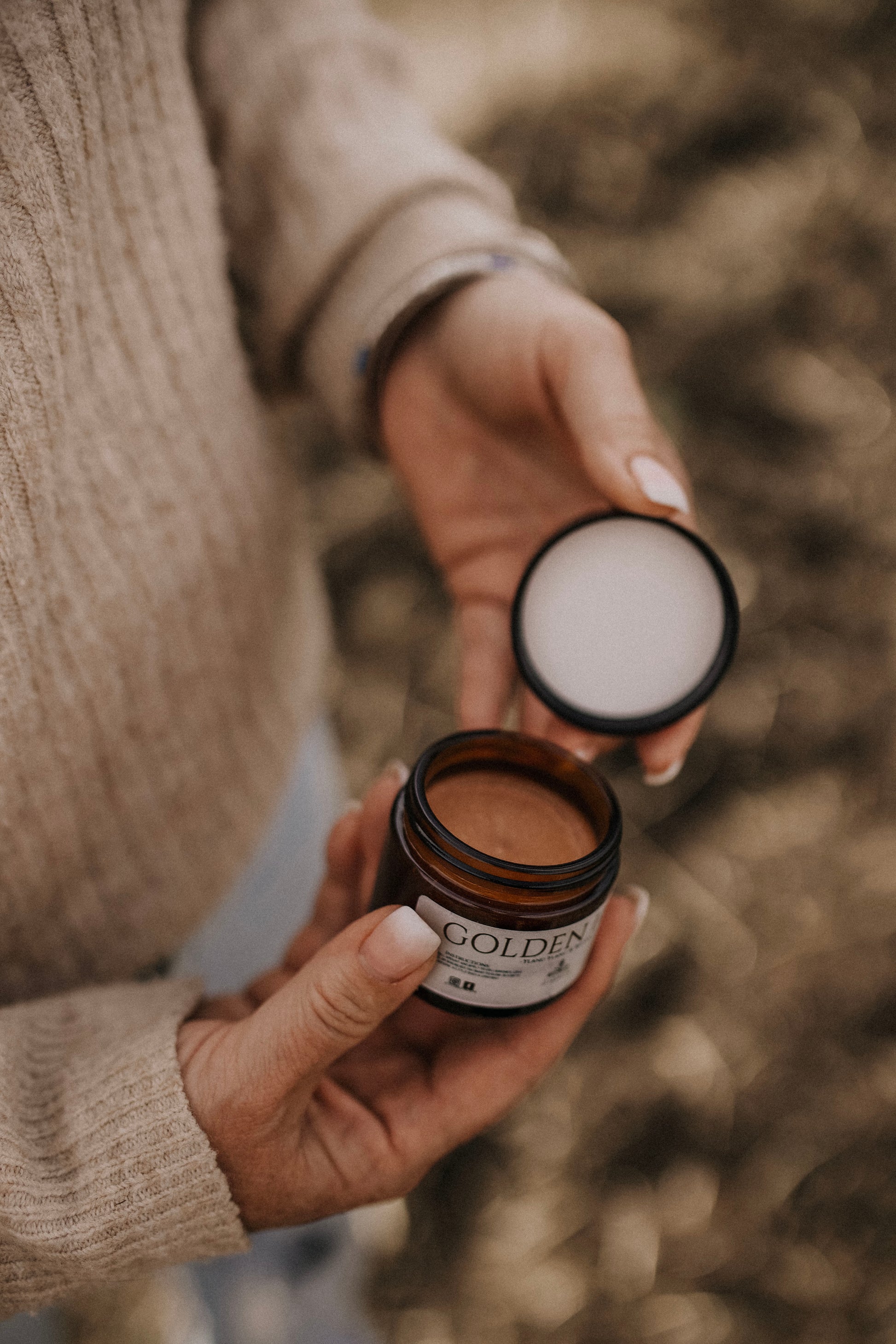 Till & Tallow Golden Hour Shimmer Body Butter in hand, handcrafted in Alberta.