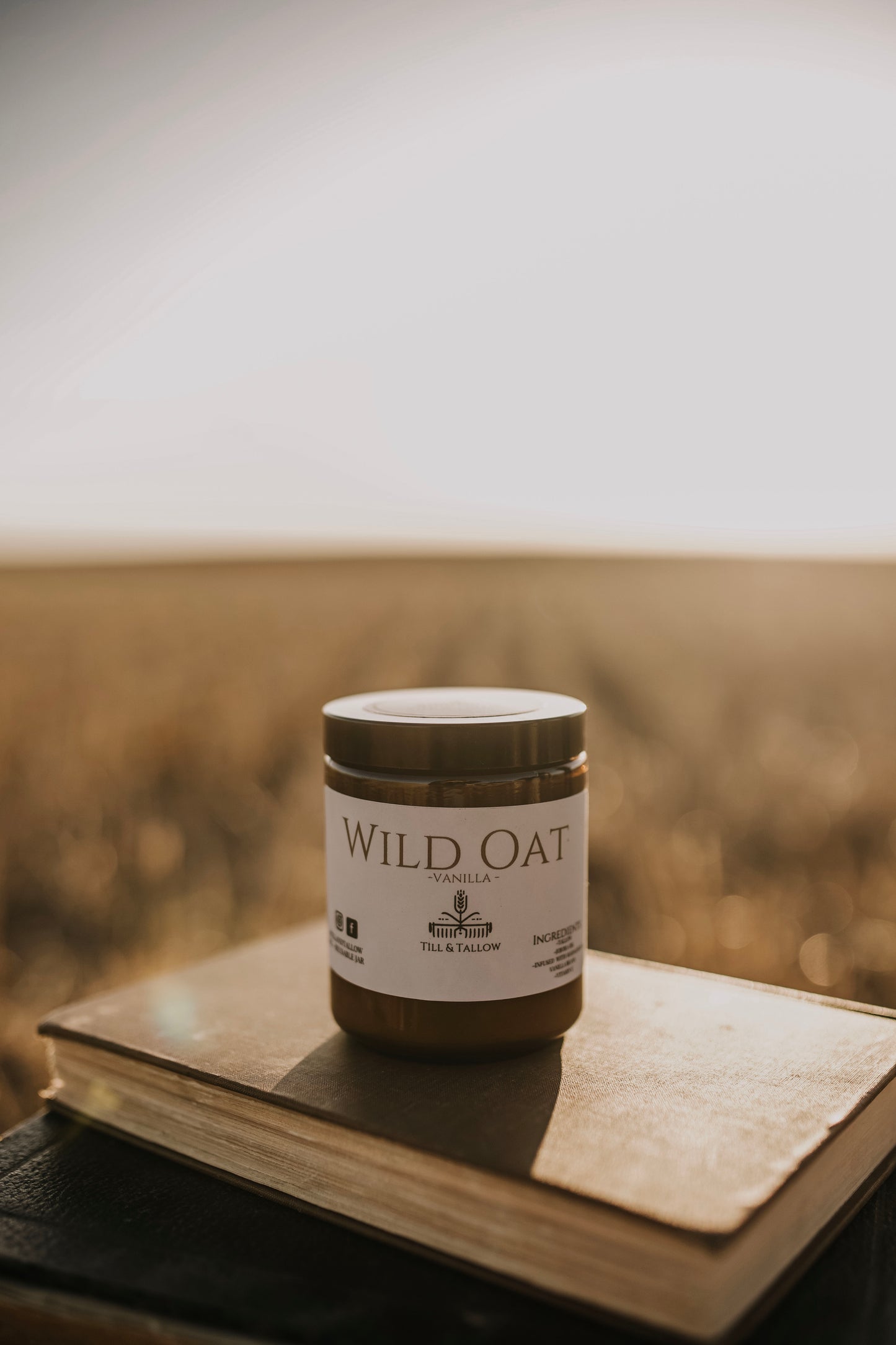 Till & Tallow Wild Oat Vanilla Body Butter on Book, handcrafted in Alberta