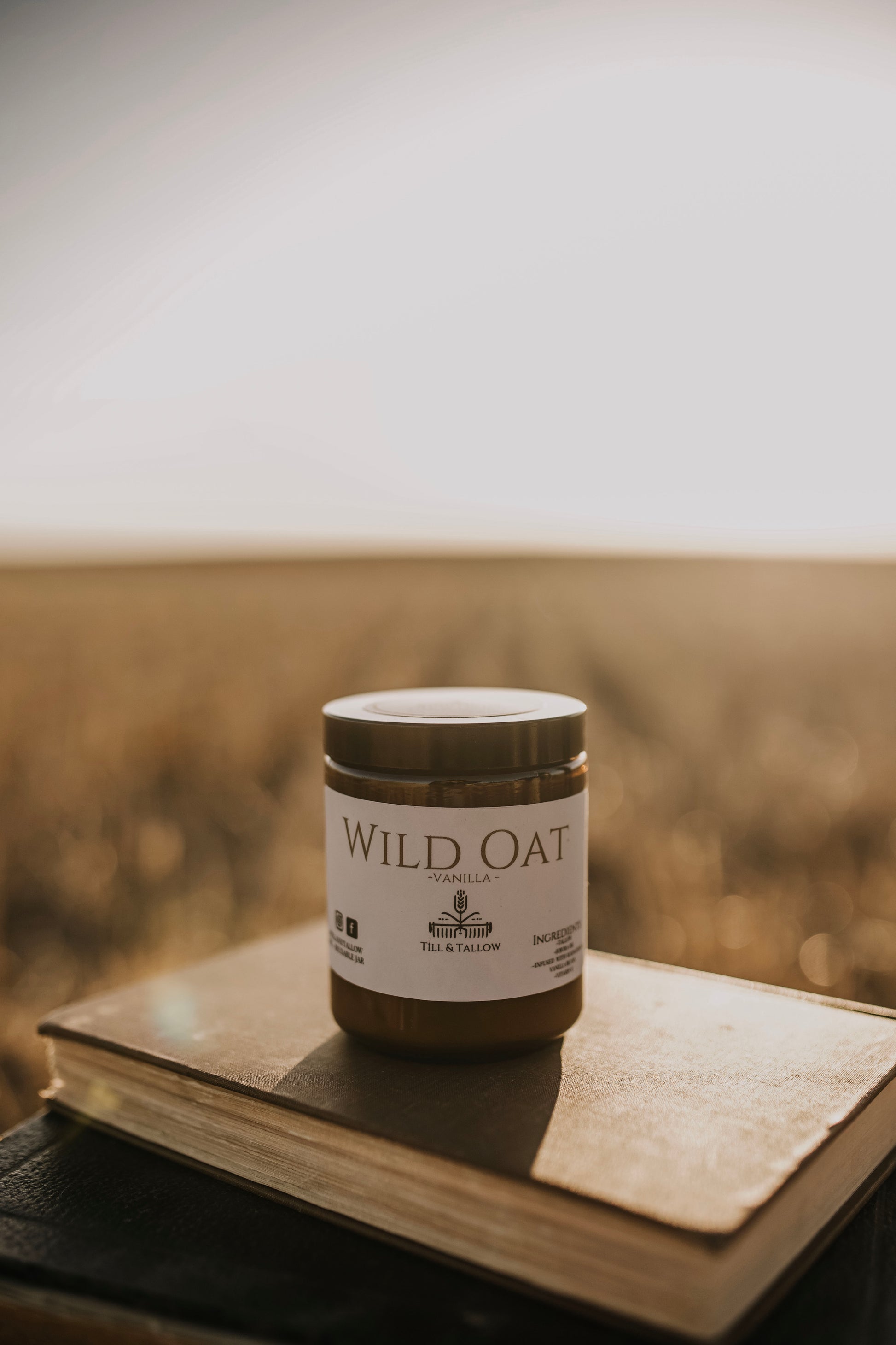 Till & Tallow Wild Oat Vanilla Body Butter on Book, handcrafted in Alberta